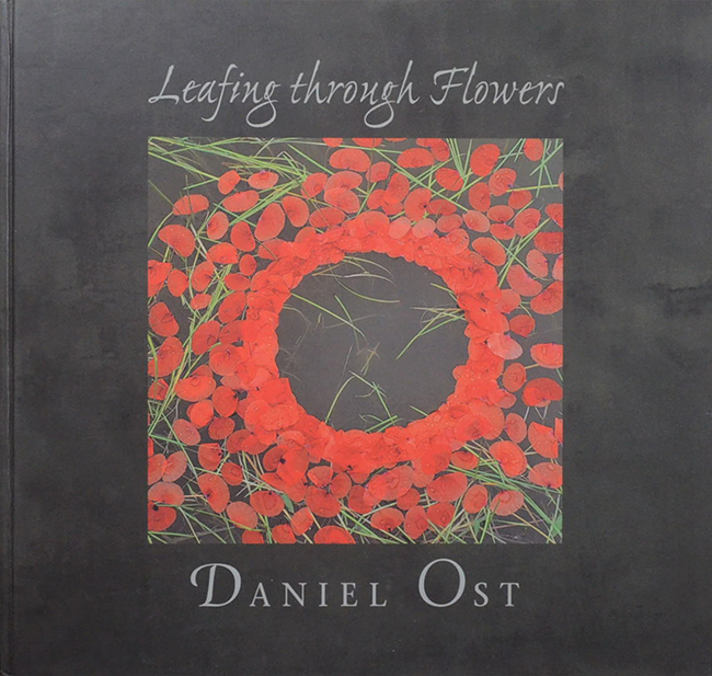 DANIEL OST LEAFING THROUGH FLOWERS